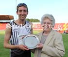 Jonathan Cook (Woodford Green)  receives the Stan Long Mile Trophy from Joan Long (Stan Long's widow), North East Grand Prix, Gateshead International Stadium. Photo: David T. Hewitson/Sports for All Pics